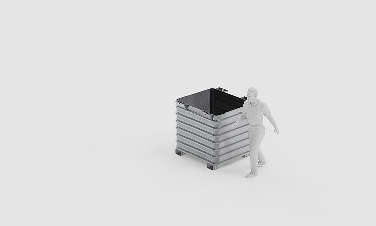 Eine Person neben einer Stahlbox
